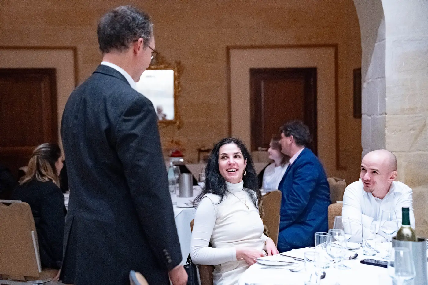 Guests speaking together during the award dinner